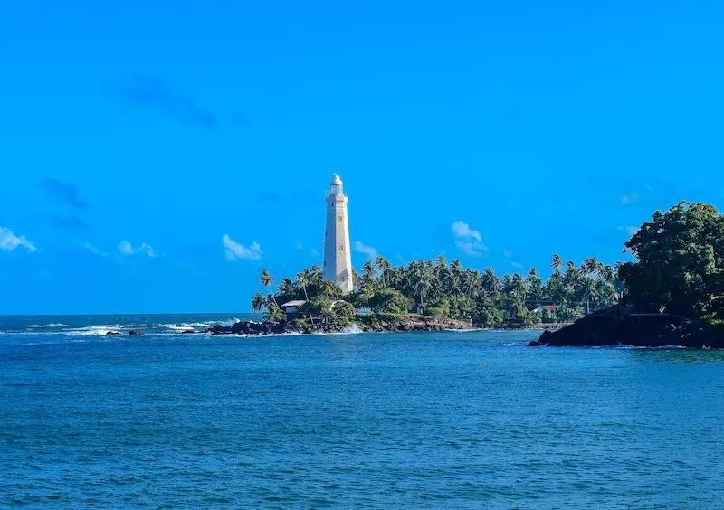 Lighthouse, blu sky and blu ocean water