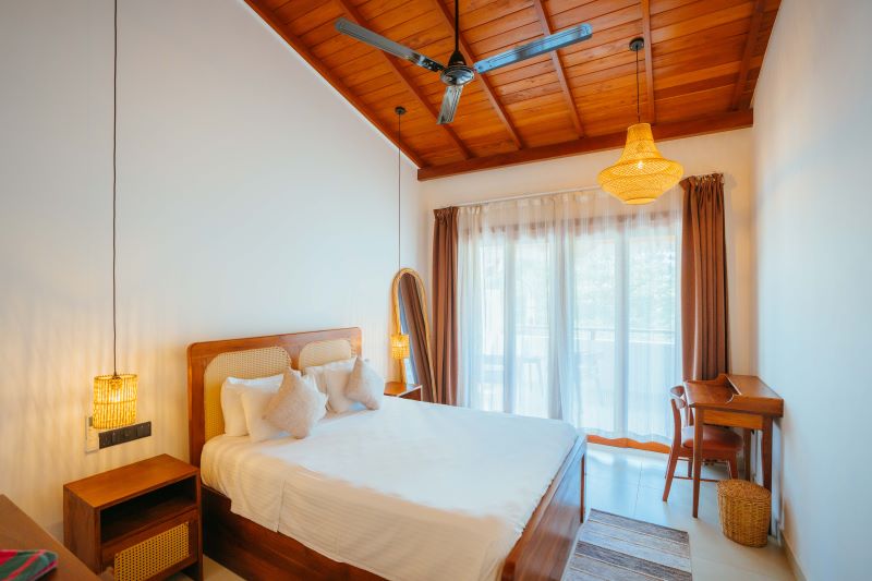 Room with rattan furniture , fan and air conditioning