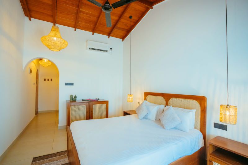 Room with wooden roof and cane lamps